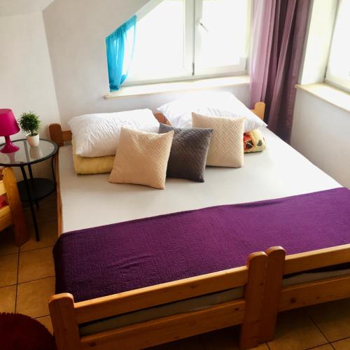 a bedroom with two beds and a window at Gospodarstwo Agroturystyczne Jacwing in Giby