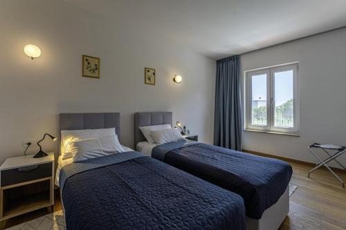 Posteľ alebo postele v izbe v ubytovaní Villa Vera in Ližnjan - Haus für 8 Personen