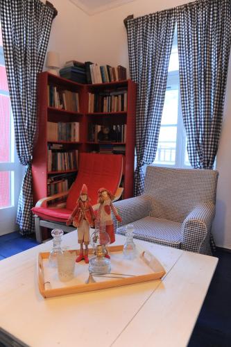two toy figurines on a table in a living room at Dandy Villas Velanidia Sailor's House - Private Maisonette - Sea View in Velanídhia