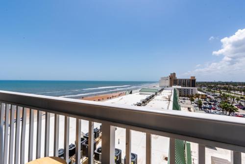 a view of the beach from the balcony of a condo at Daytona Beach Resort - Ocean Front Luxury Studio in Daytona Beach