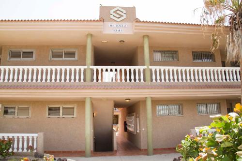 a large building with a balcony on top of it at Navy Apartment, El Poris in Arico