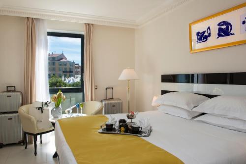 Postel nebo postele na pokoji v ubytování Hotel Aston La Scala