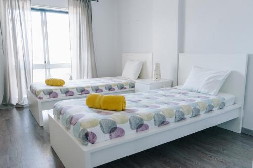 Кровать или кровати в номере Ocean Guesthouse Peniche