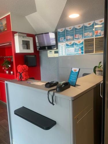 a kitchen with a counter with a phone on it at hotelF1 Beauvais in Beauvais