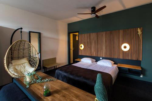 Кровать или кровати в номере Hotel Café Restaurant De Posthoorn