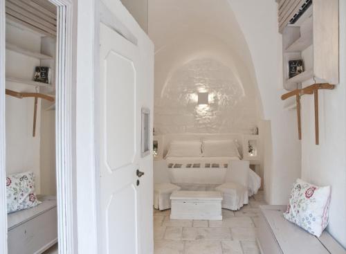 A bed or beds in a room at Masseria Salinola