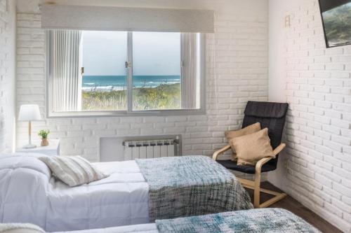 Postel nebo postele na pokoji v ubytování Portobello Suites Hotel