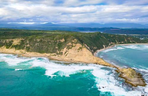 an aerial view of a beach and the ocean at Simbavati Fynbos on Sea in Sedgefield