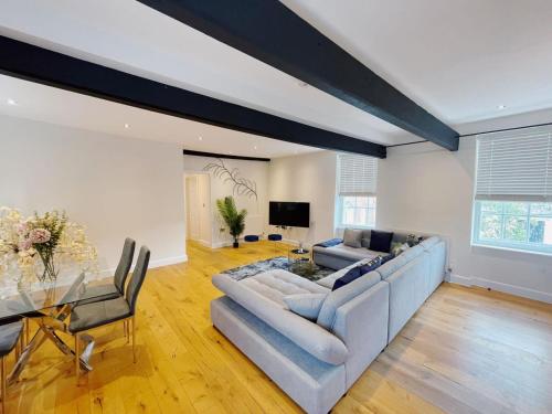 a living room with a couch and a table at 73B Weavers House - Mountergate in Norwich