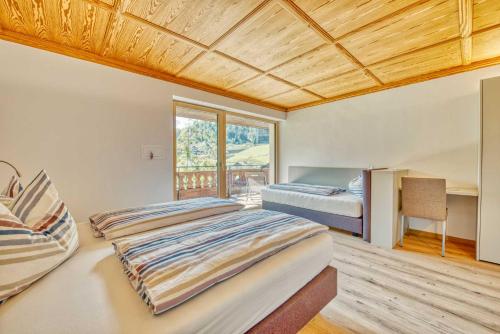 Postel nebo postele na pokoji v ubytování Residence Schnals