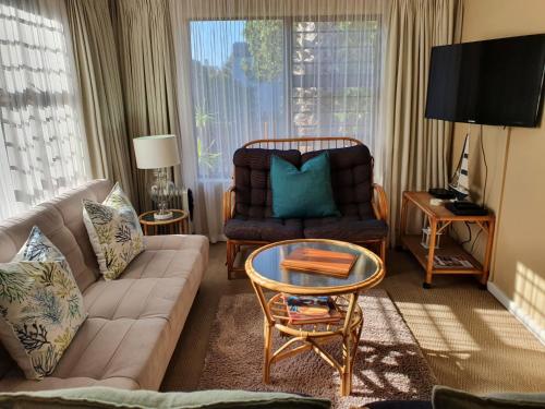 a living room with a couch and a chair at The Gull in Sedgefield