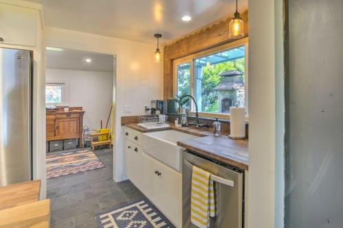 a kitchen with a sink and a window at Scenic Lake Almanor Home with Mountain Views! in Lake Almanor