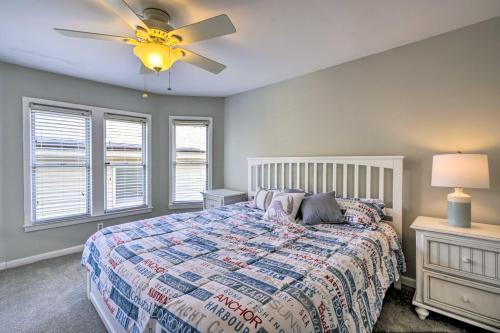 a bedroom with a bed and a ceiling fan at Charming Ocean City Townhome Walk to Beach! in Ocean City