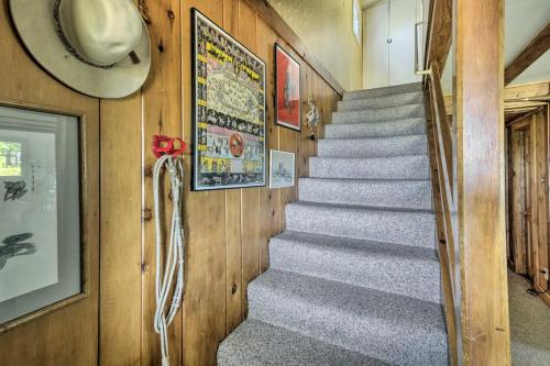 a staircase in a house with a hat on the wall at Scenic Lake Almanor Home with Mountain Views! in Lake Almanor
