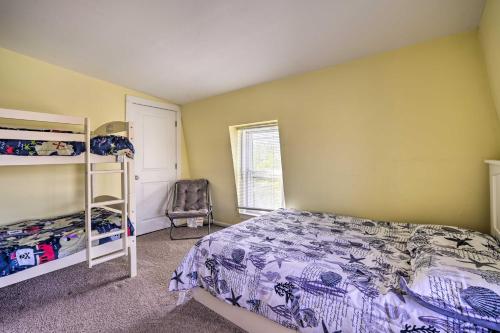 a bedroom with a bed and a chair at Charming Ocean City Townhome Walk to Beach! in Ocean City