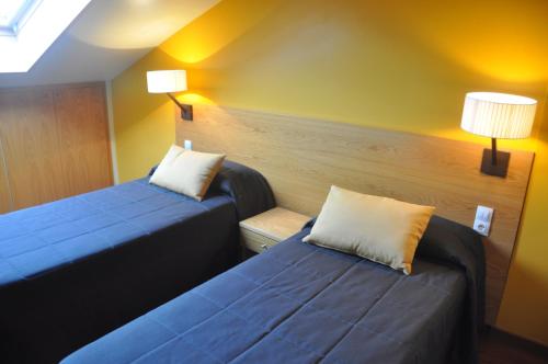 Postel nebo postele na pokoji v ubytování Apartaments Turístics Puigcerdà - La Closa