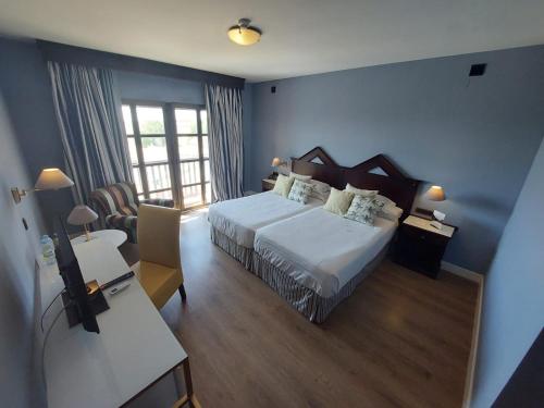 Ein Bett oder Betten in einem Zimmer der Unterkunft RL Ciudad de Úbeda