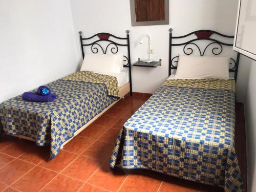 Un ou plusieurs lits dans un hébergement de l'établissement Apartamento La Caletilla