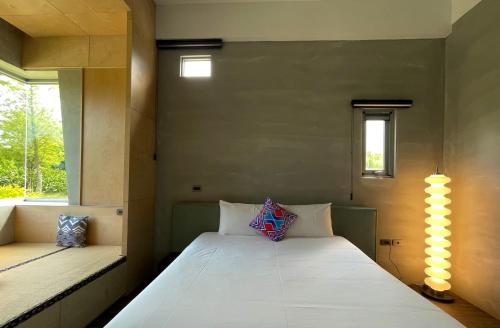 Cama o camas de una habitación en 靜樹湖民宿Jing Shuhu B&B