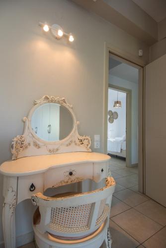 a bathroom with a mirror and a sink at Villa Elena in Milatos