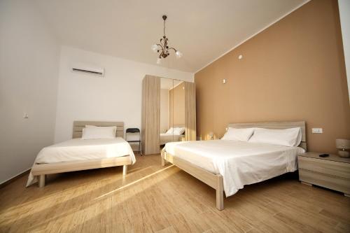 Tempat tidur dalam kamar di B&B Bouganville