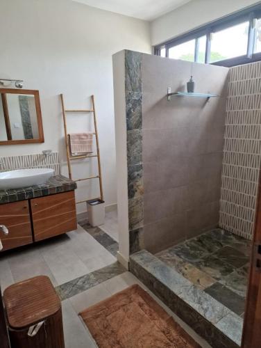 a bathroom with a shower and a sink at Villa centre Grand Baie in Grand Baie