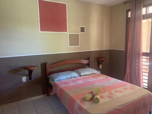 Un pat sau paturi într-o cameră la Residence Ondas do Mar