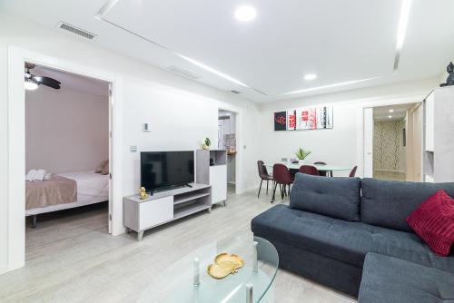 Televízia a/alebo spoločenská miestnosť v ubytovaní Moderno apartamento Centro Granada