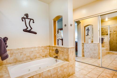 a large bathroom with a tub and a shower at Mauna Lani Resort 1401 in Waikoloa