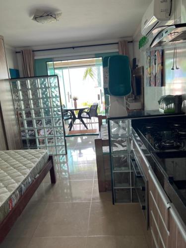 a kitchen with a stove and a counter top at Village Galés de Maragogi in Maragogi