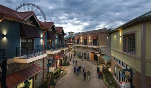 a group of people walking down a street at Margaritaville Island Hotel in Pigeon Forge