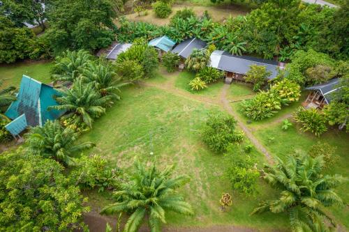 an aerial view of a resort with palm trees at El Chontal in Rincón