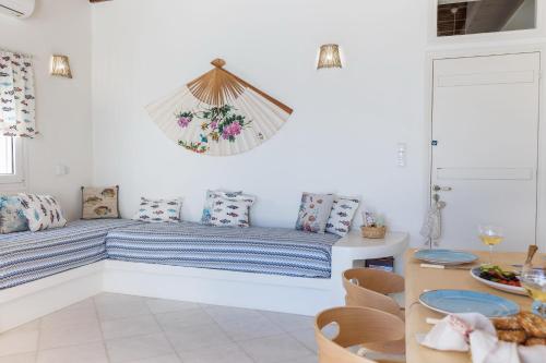 a living room with a couch and a table at Ma mer in Naxos Chora