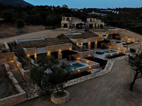 an aerial view of a house with a pool at Fari Stone Villas in Skala Marion