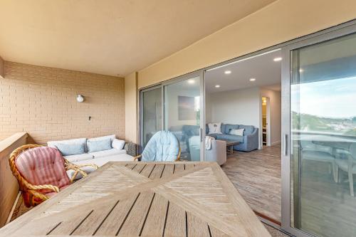 a living room with a table and a living room with a couch at Rehoboth Beach --- 23 Maryland Ave #500 - Tidewater House in Rehoboth Beach