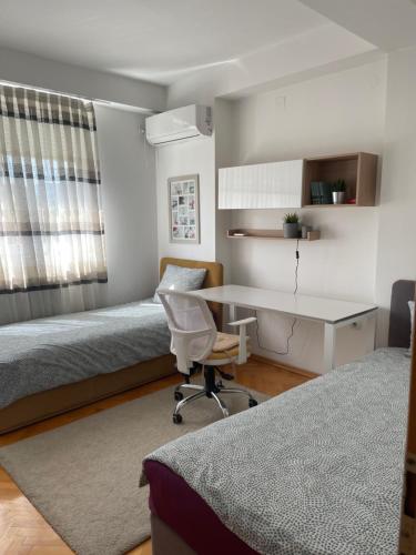 Postelja oz. postelje v sobi nastanitve Tina Apartments