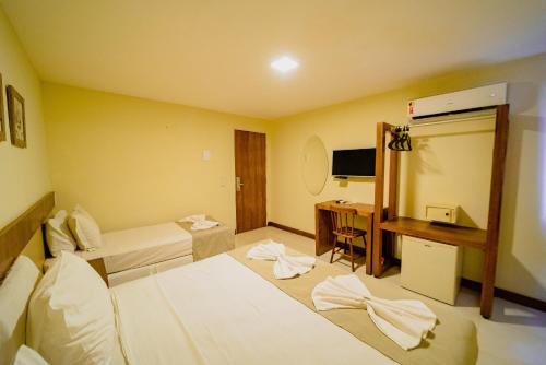 Postel nebo postele na pokoji v ubytování Fortmar Hotel