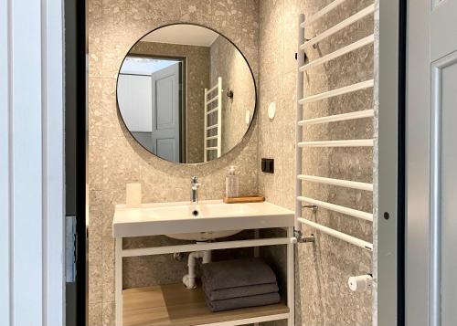 a bathroom with a sink and a mirror at SÖRWESPA Nature Resort in Salme