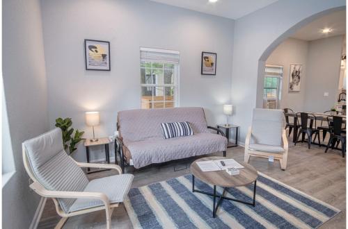 a living room with a couch and chairs and a table at Cozy and Lovely 2BR 2BA Apt#A Near Lively Downtown in San Antonio