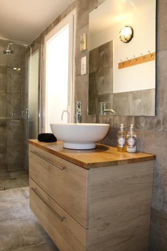 a bathroom with a sink and a mirror at Geronimo Guest House Belém in Lisbon