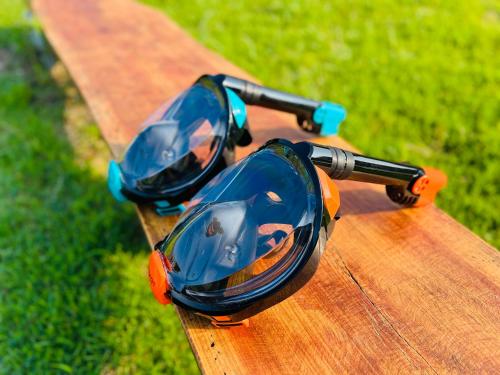 a pair of sunglasses sitting on top of a wooden table at Tsushima Miuda Pension in Tsushima
