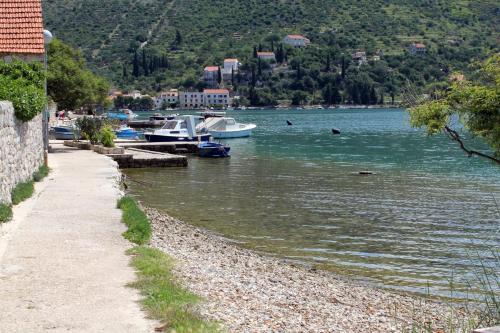 a group of boats docked in a body of water at Triple Room Zaton Mali 8997d in Zaton