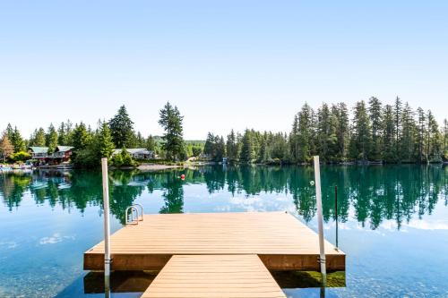 a dock in the middle of a lake at The Lakefront Treehouse in Shelton
