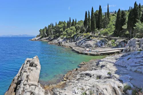 a view of a body of water with trees at Apartments with parking space Trpanj, Peljesac - 10148 in Trpanj