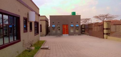 a building with a red door on the side of it at Macb Estate - Apartments in Chililabombwe in Chililabombwe