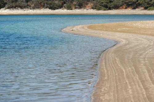 a beach with a body of water at Apartment Blaca 4899e in Maranovići