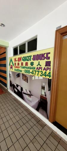 a room with a bathroom with a toilet and a window at Api-Api GuestHouse in Kota Kinabalu