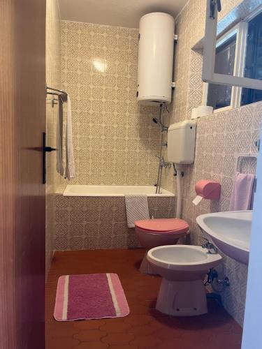 a small bathroom with a toilet and a sink at Apartments by the sea Racisce - Korcula - 4359 in Račišće
