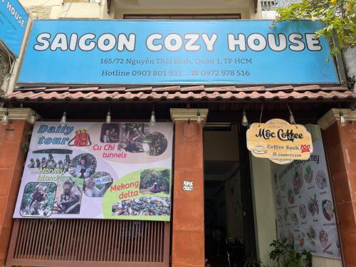 a sign for a saigon cozy house on a building at Saigon Cozy House & coffee in Ho Chi Minh City