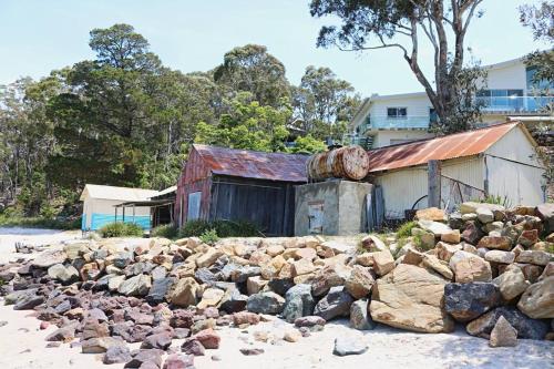 a pile of rocks in front of a building at Sun Kissed - As close as you get to Pambula Beach in Pambula Beach